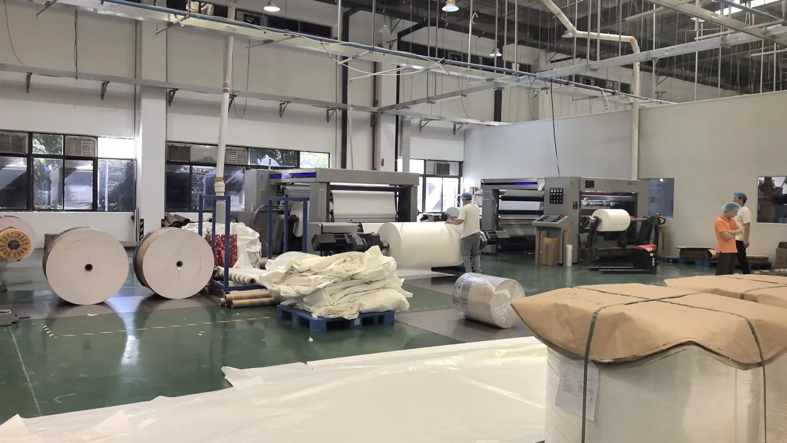 LANGMAI production team working in the paper packaging workshop